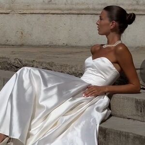 The New Arrivals brand new dress. Ivory color. Size 36 French and I am 4 US